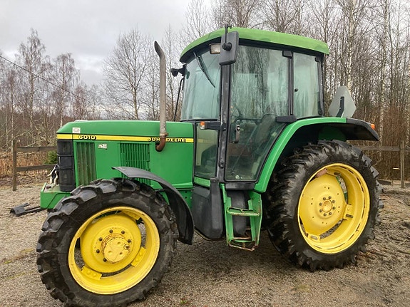 John Deere 6010 med vändbar stol