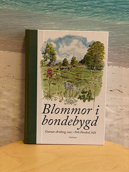 Boken Blommor i bondebygd, 2009, signerad av båda författarna.