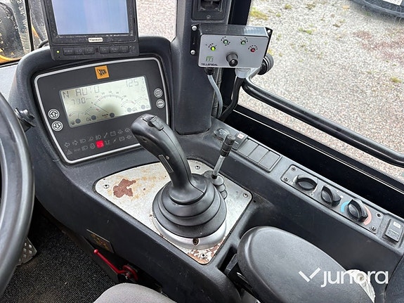 Hjullastare JCB 411 HT med vikplog 11 of 30