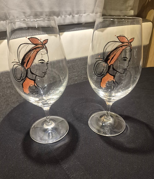 Kosta Boda ölglas med kvinnoillustration