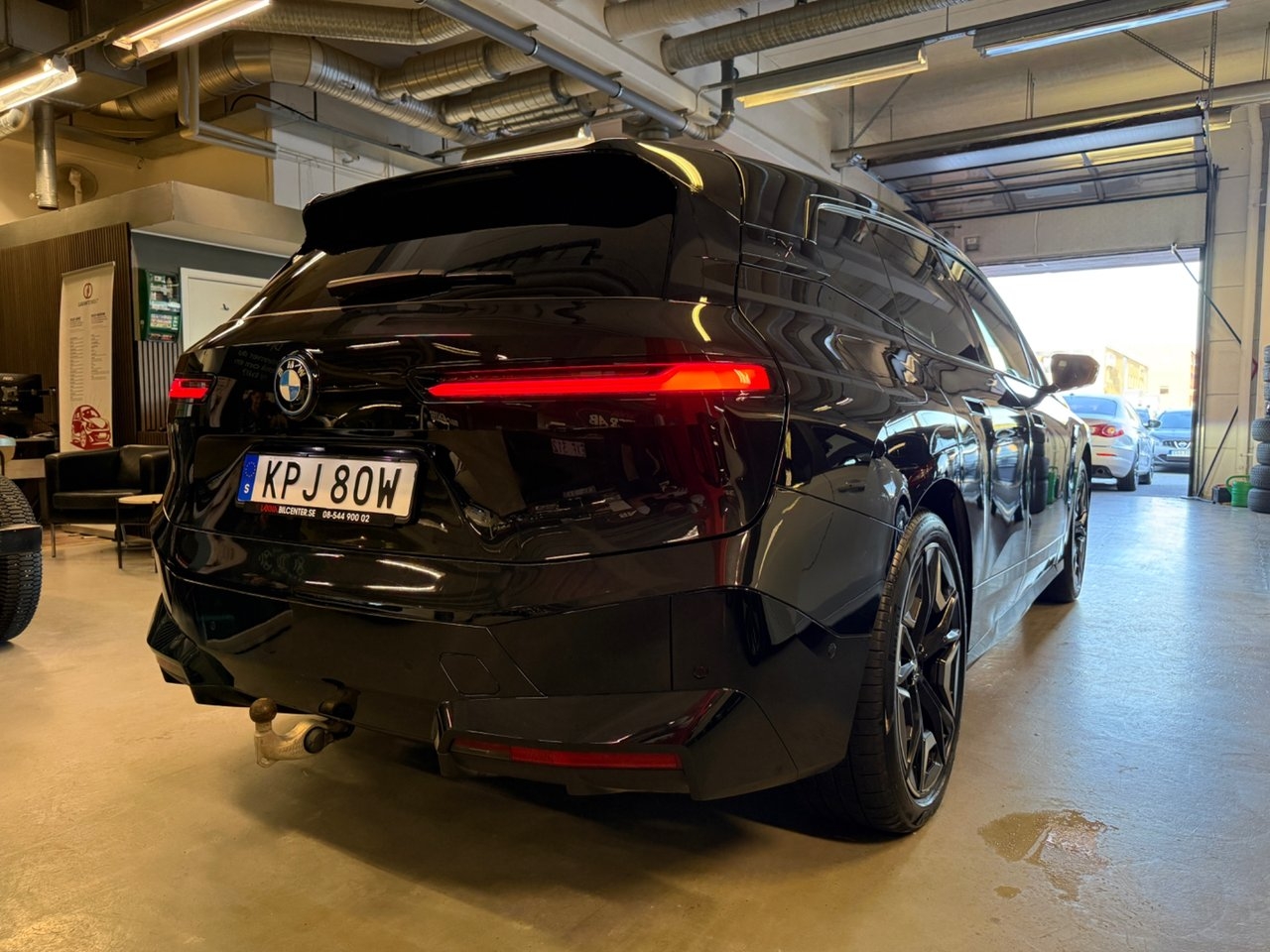 BMW iX 2024, photo 6/10